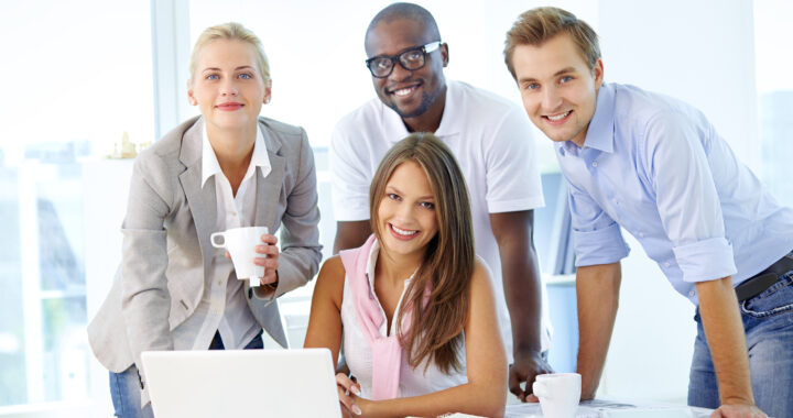 Employee at desk smiling