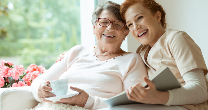 Elderly woman with caregiver